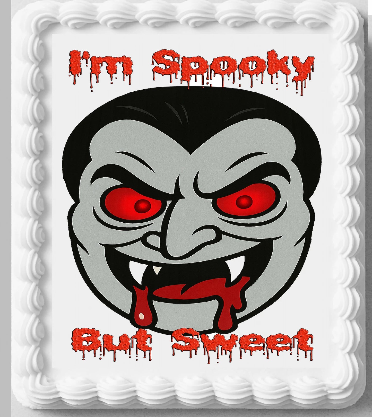 Edible Icing Images Cake Topper with a vampire face design and text 'I'm Spooky But Sweet'