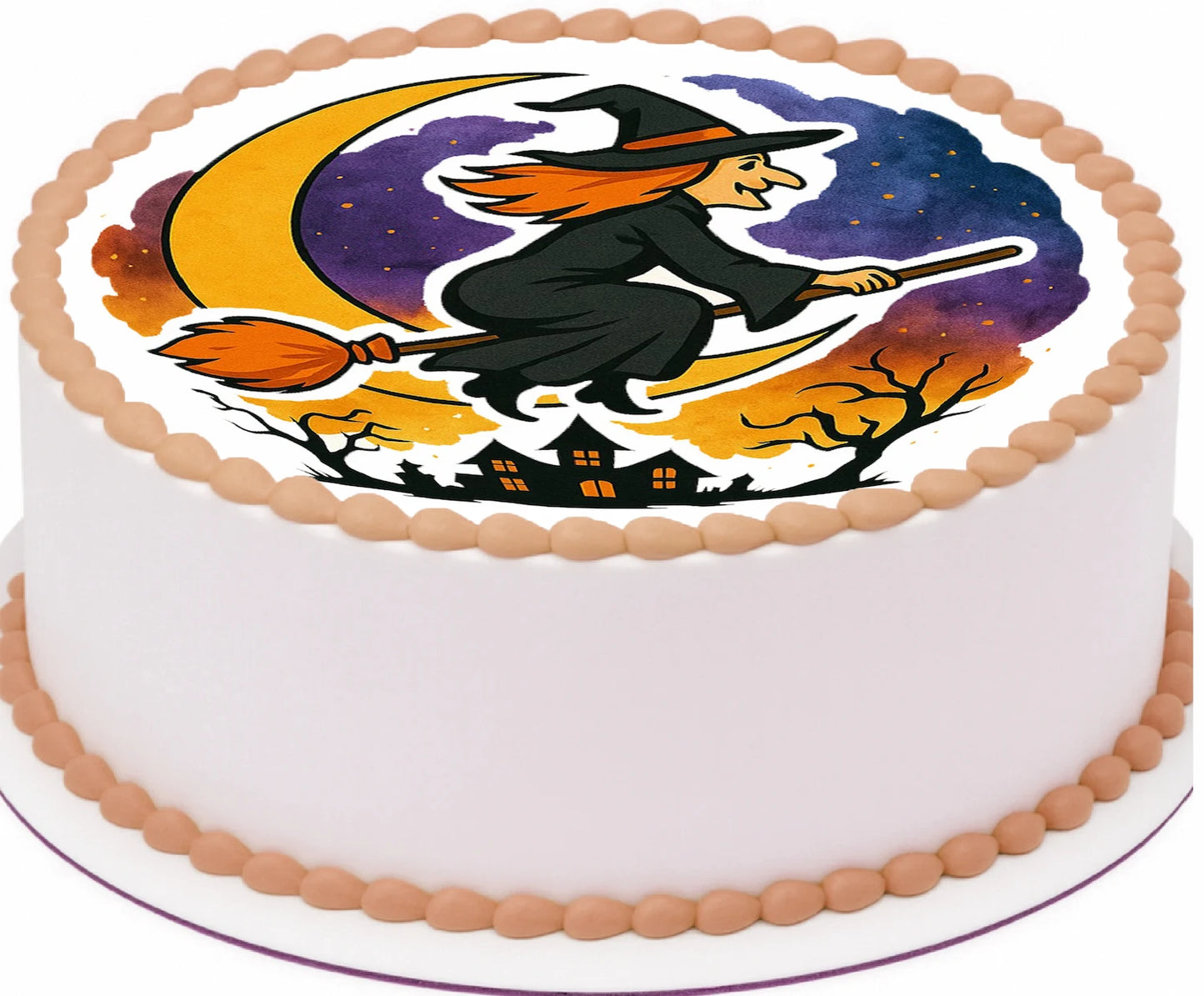 Halloween-themed edible image cake topper with a witch on a broom over a moon design.