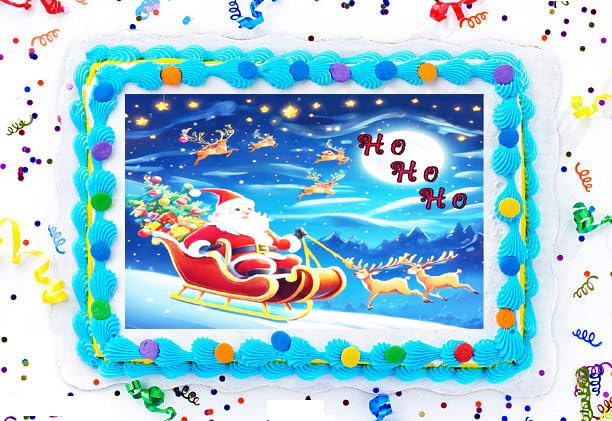 Decorative cake with Santa Claus and reindeer design, surrounded by colorful confetti.