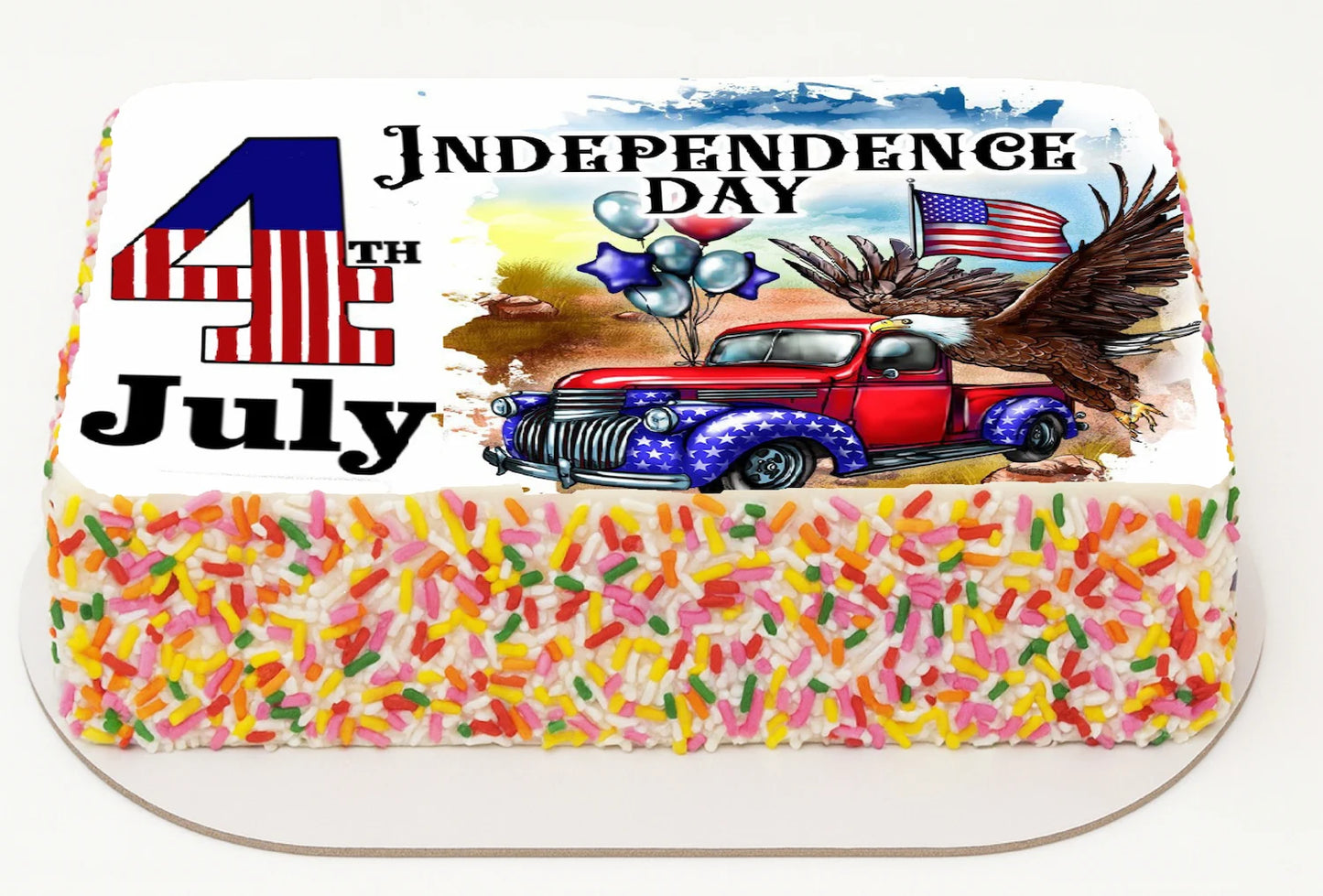 Rectangular cake decorated like the American flag with colorful sprinkles on a white background
