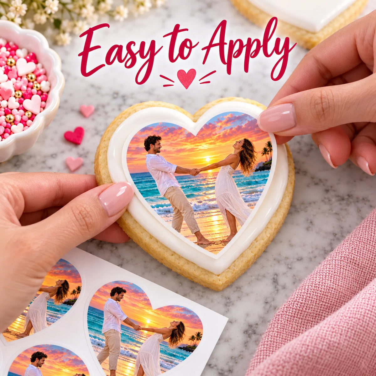 Placing a precut custom photo heart edible icing sheet directly onto a frosted sugar cookie