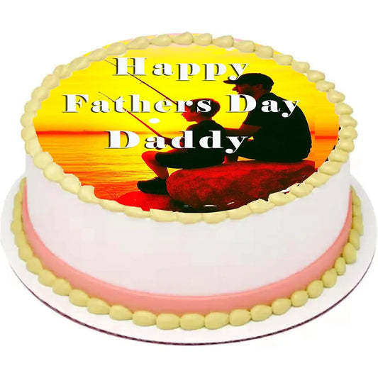 Father's Day edible icing cake topper with a father and child fishing at sunset, shown on a frosted cake.
