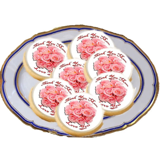 Mother's Day Peach Rose Bouquet Edible Cookie & Cupcake Toppers – 20 Precut on a plate of cookies.