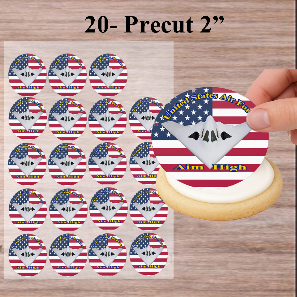 Package of 20 Air Force Aim High Edible Image Cookie & Cupcake Toppers with a hand holding an edible cookie image being applied to a cookie