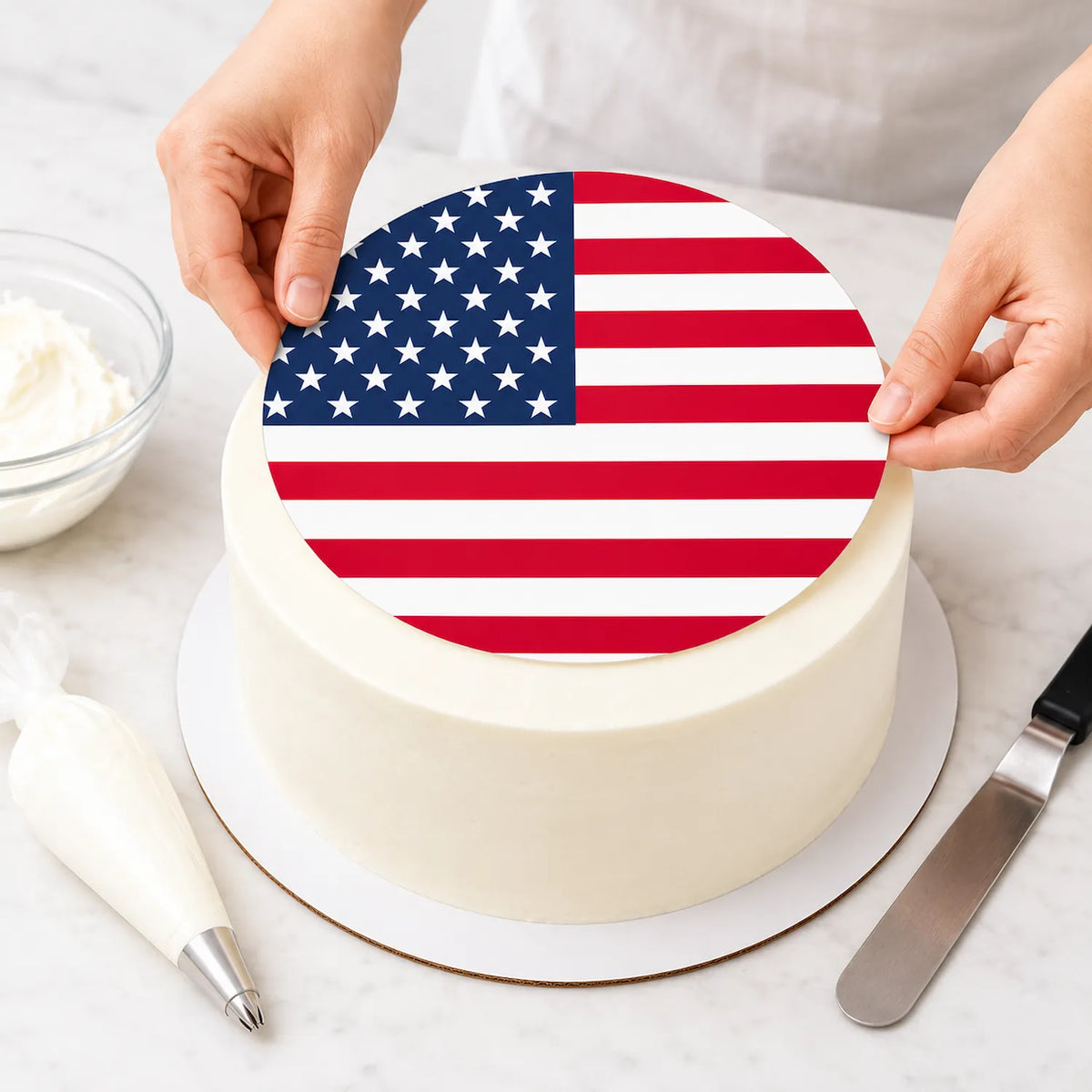 American Flag Custom Edible Icing Cake Topper – 8-Inch Round being placed on a frosted cake.