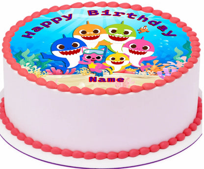 Baby shark edible image cake topper with 'Happy Birthday' and shark cartoon characters.