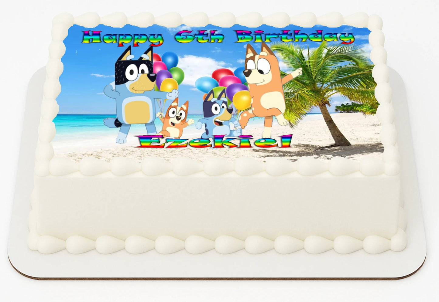 Bluey Dog  Edible Icing Images Cake Topper with a Customizable/Personalized 'Happy Nth Birthday'  and Name featuring dog cartoon characters on a beach.