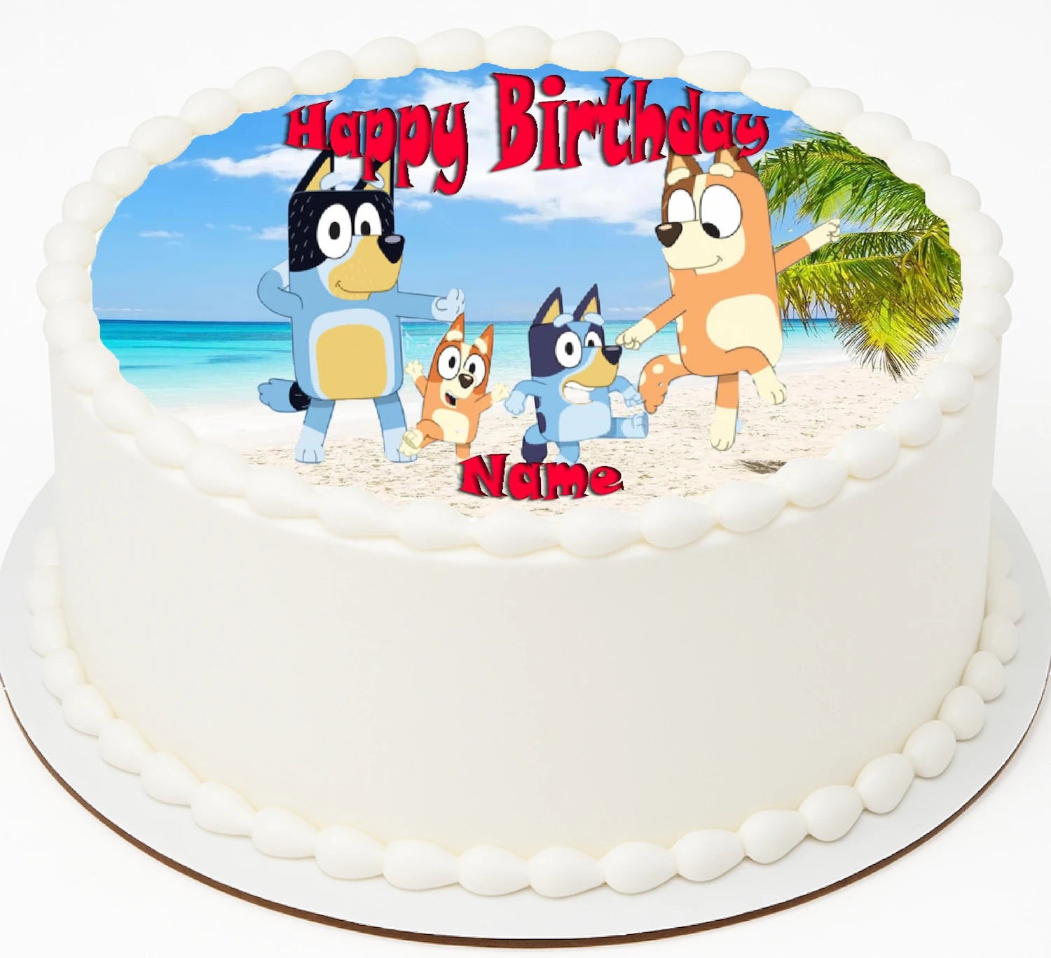 Birthday edible image cake topper with cartoon bluey characters on a beach scene
