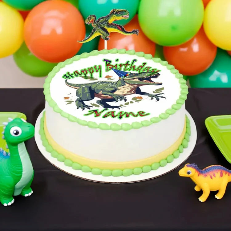 Birthday cake with dinosaur design surrounded by balloons and toy dinosaurs on a black tablecloth.