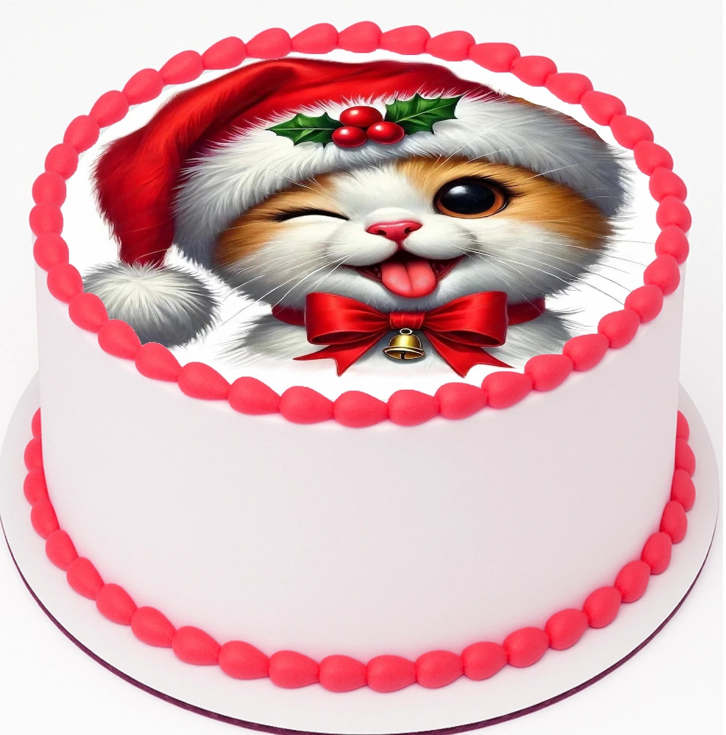 Christmas Cat Edible Cake Image on top a cake with red icing trim.  The cake image has a cat wearing a santa hat with eye winking, and tongue out, while wearing a santa hat and bow tie.