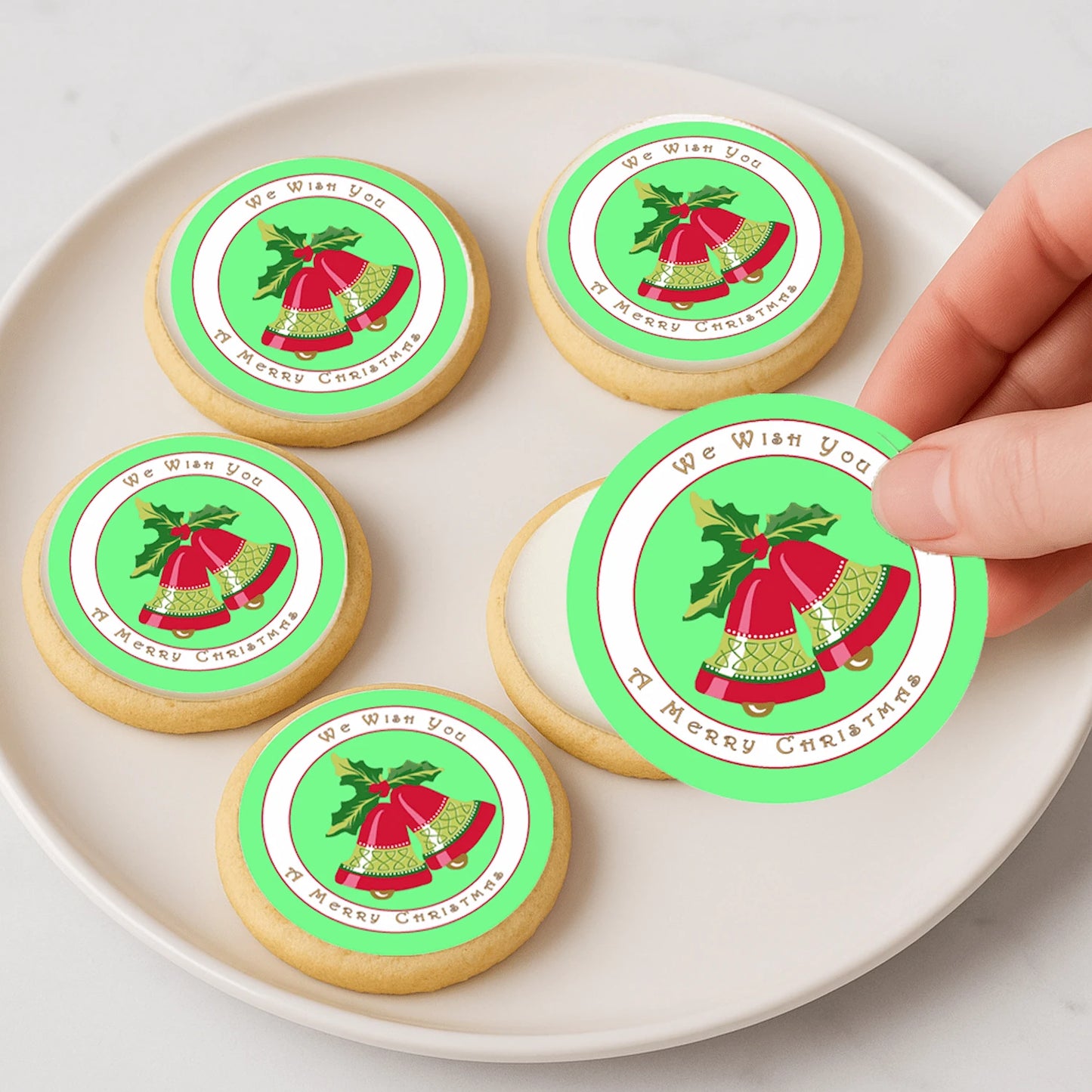 Christmas Bells edible cake images being placed on cookies – holiday dessert icing images for party treats