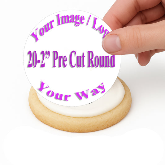 Customized edible Cake image being placed on top a frosted cookie by hand.