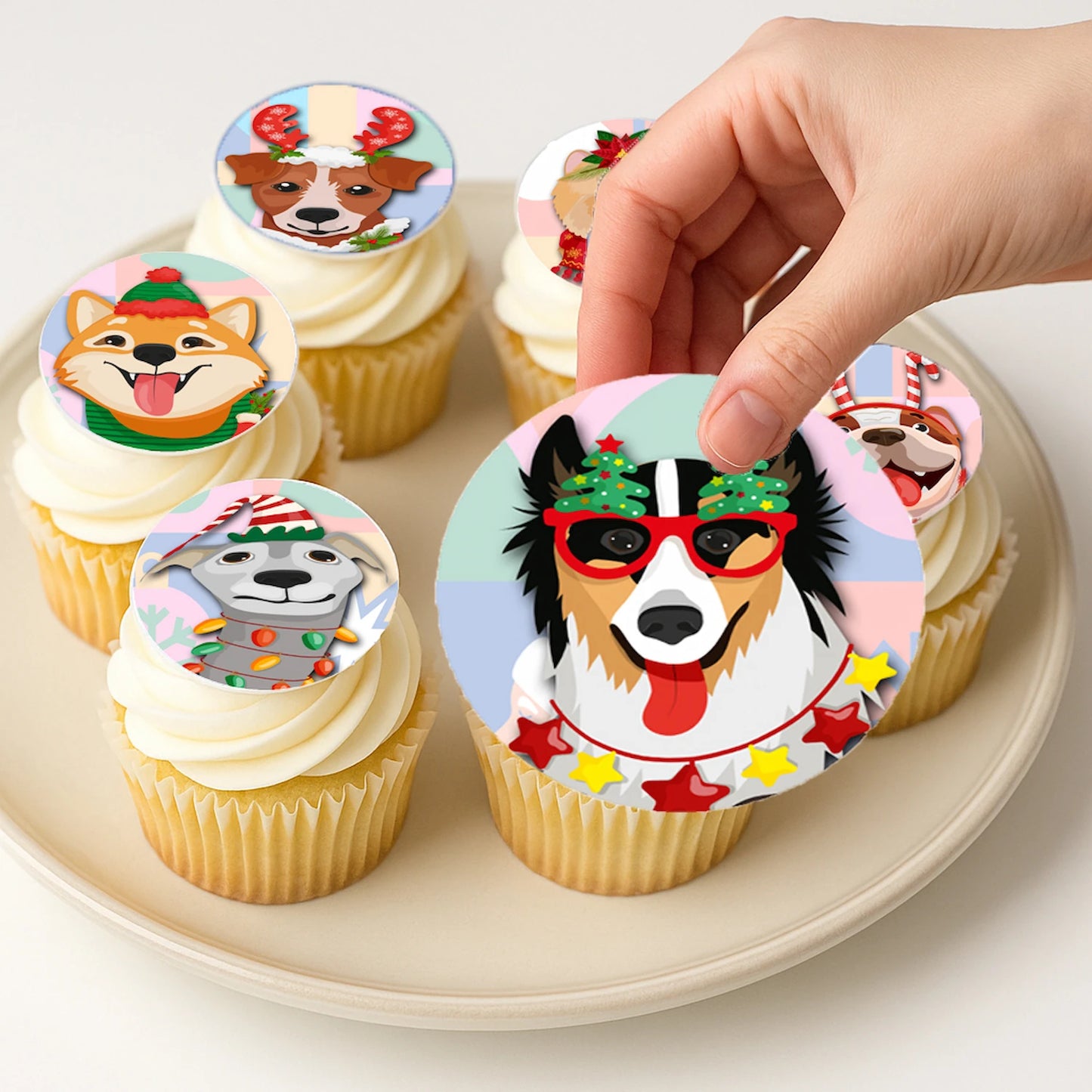 Applying Christmas Canine Crew edible cake images on frosted cupcake – Christmas Canine Crew edible cake images are perfect holiday treats
