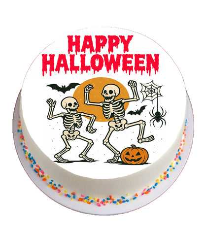 Halloween-themed cake topper with skeletons, pumpkins, and 'Happy Halloween' text.