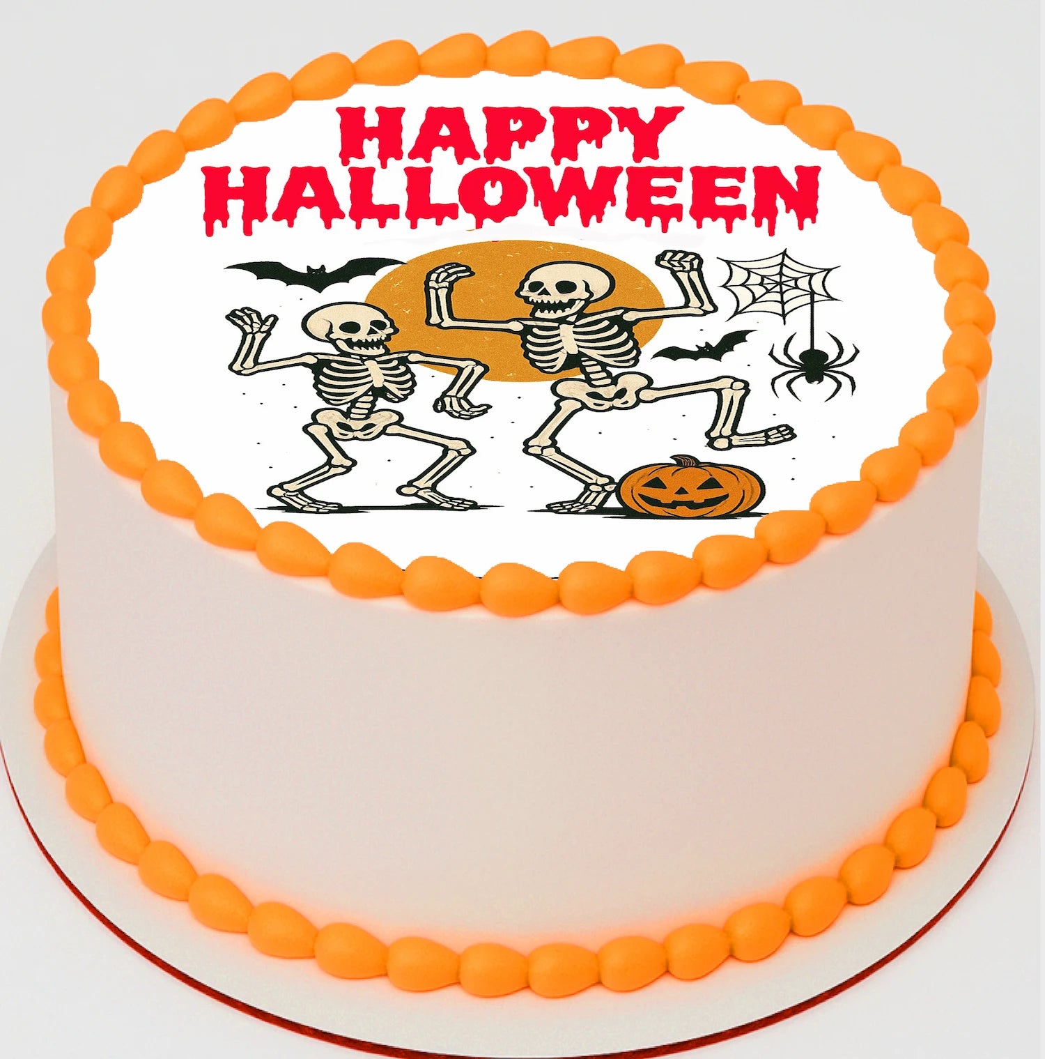 Halloween cake with skeletons, pumpkins, and 'Happy Halloween' text 