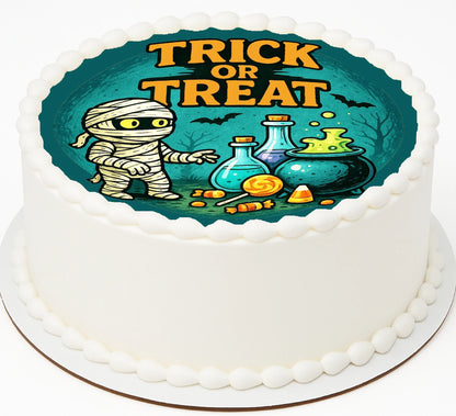 Halloween-themed cake with mummy mixing up a brew of candy and pumpkins