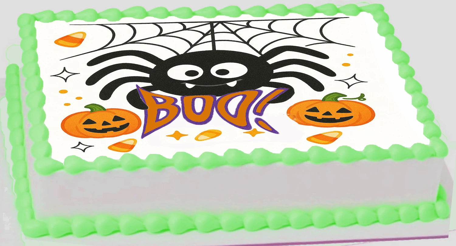 Halloween-themed Edibe cake topper  with spider, pumpkins, and 'BOO!' text