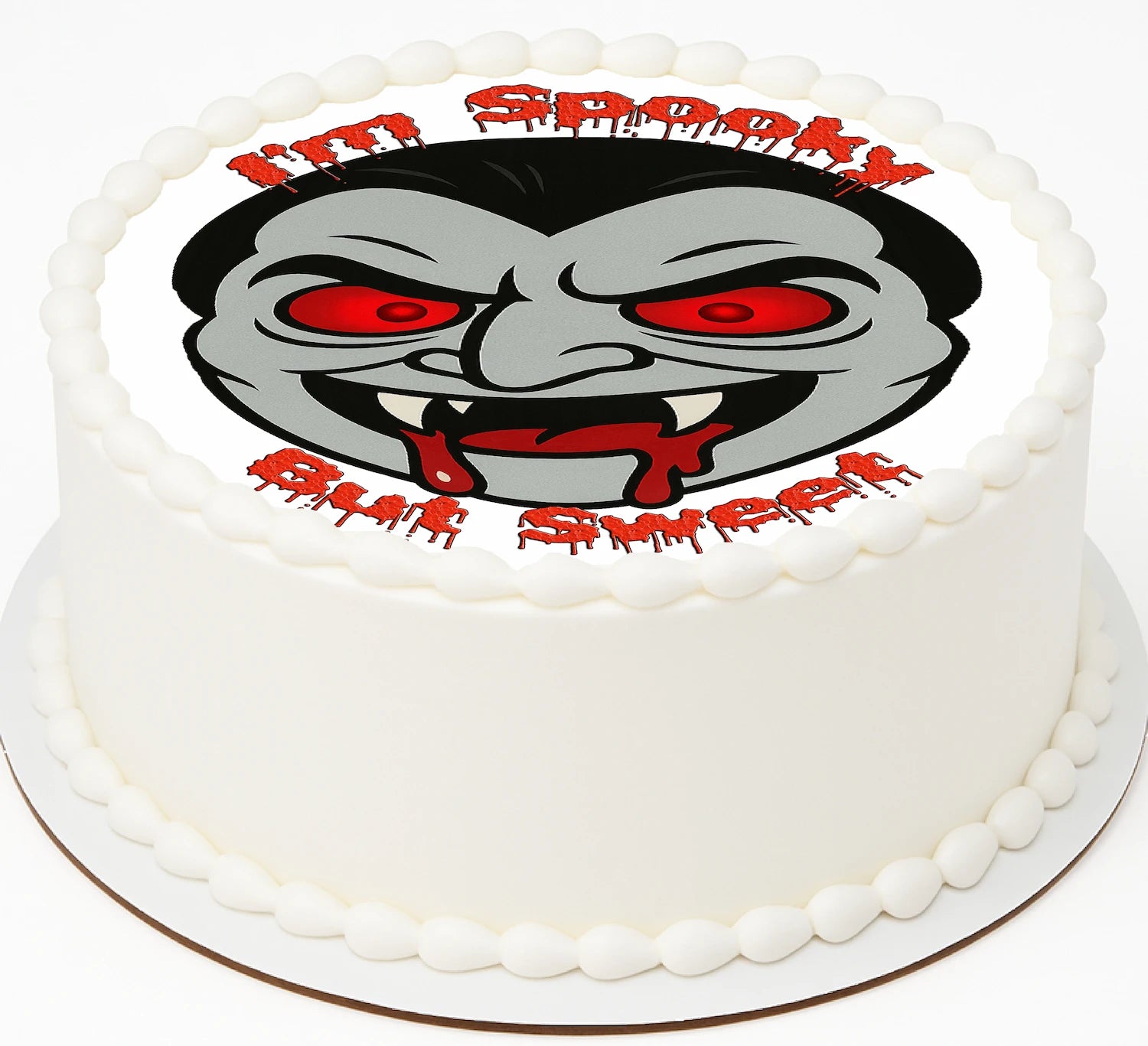Edible Image for cake with a Vampire face and text sayig 'I'm spooky but Sweet'