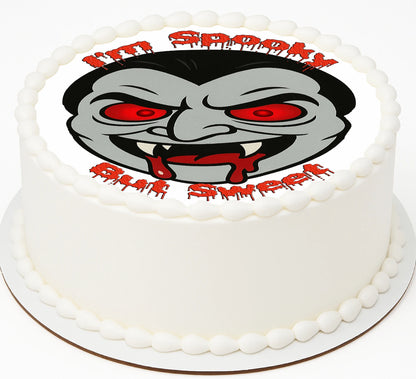 Edible Image for cake with a Vampire face and text sayig 'I'm spooky but Sweet'