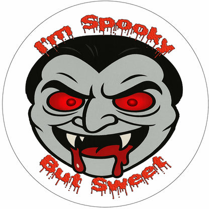 Cartoonish vampire face with red eyes and text 'I'm Spooky But Sweet' edible icing image