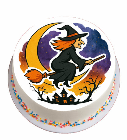 Halloween-themed cake topper with a witch flying on a broomstick.