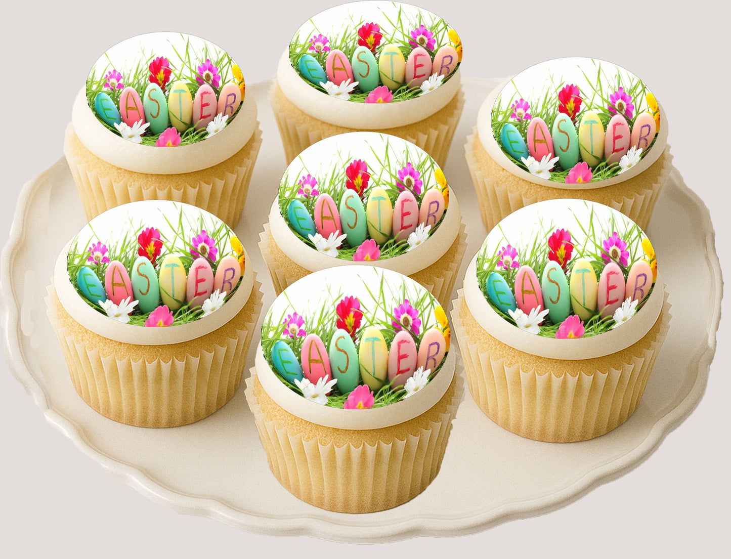 Decorative cupcakes with Easter-themed decorations on a white plate.