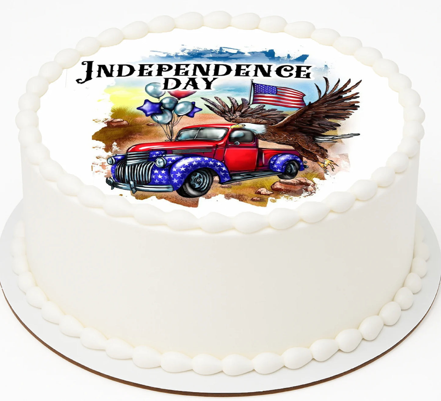 Cake with Independence Day design featuring a red truck, eagle, and American flag.