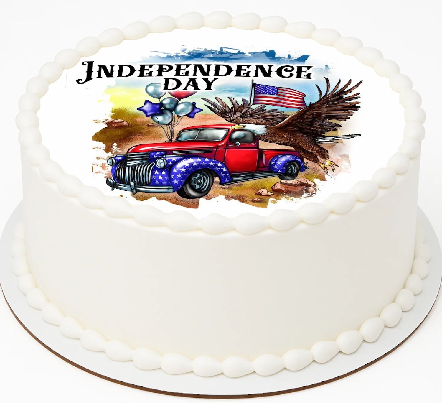 Cake with Independence Day design featuring a red truck, eagle, and American flag.
