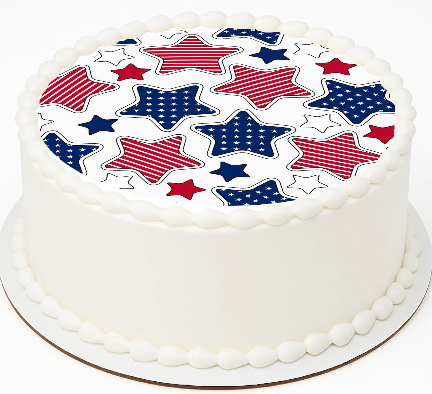 White cake with edible imag ecake topper with red, blue, and white star pattern