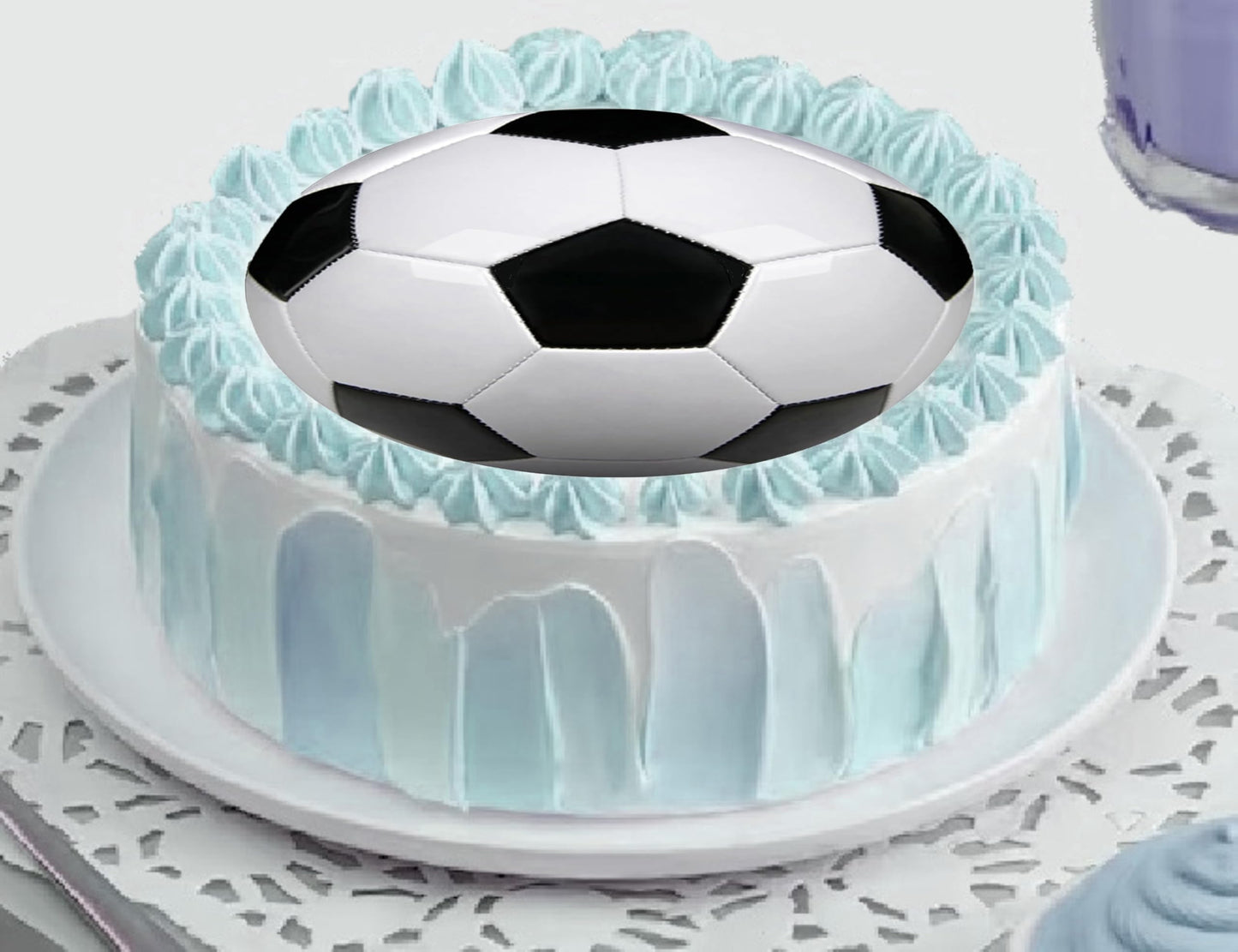 Cake topper with a soccer ball design edible image.