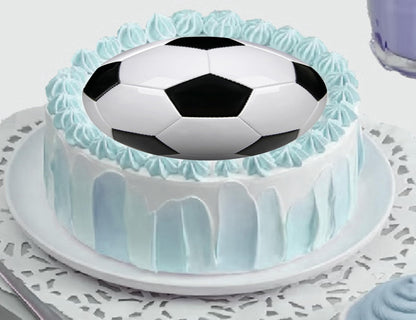 Cake topper with a soccer ball design edible image.