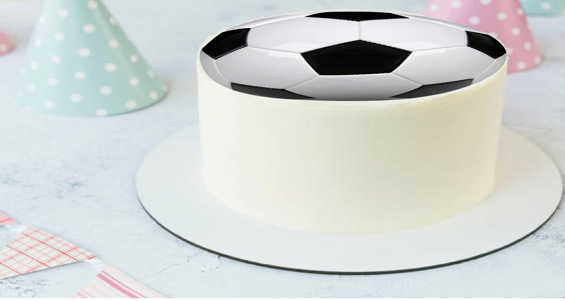 Edible image cake topper with a black and white soccer ball design.