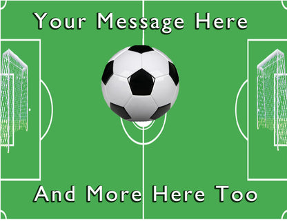 Soccer ball on a green field with text 'Your Message Here' and 'And More Here Too' on an edible icing image cake topper.