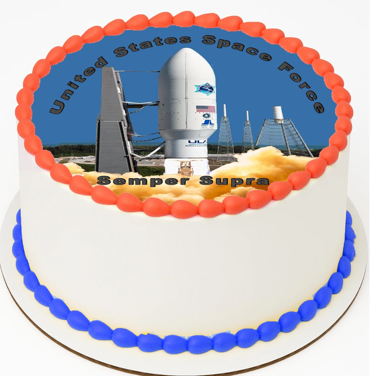 Cake with space-themed decoration featuring a rocket and 'United States Space Force Semper Supra' text.