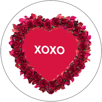 Heart-shaped arrangement of red roses with 'XOXO' text on a white background