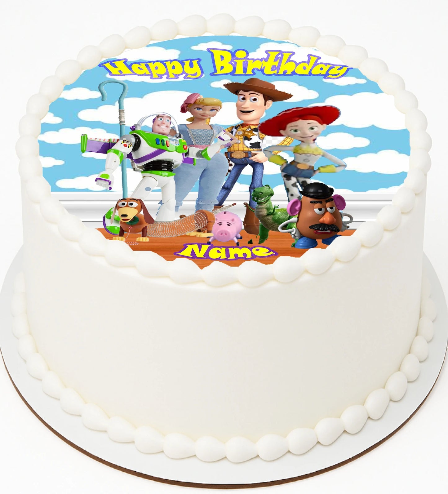 Edible Icing Images Toy Story Cake Topper on a white cake