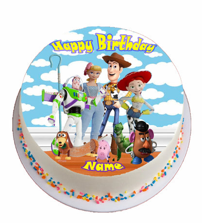 cake topper on a  cake with toy story charactors and 'Happy Birthday Ethan' text.