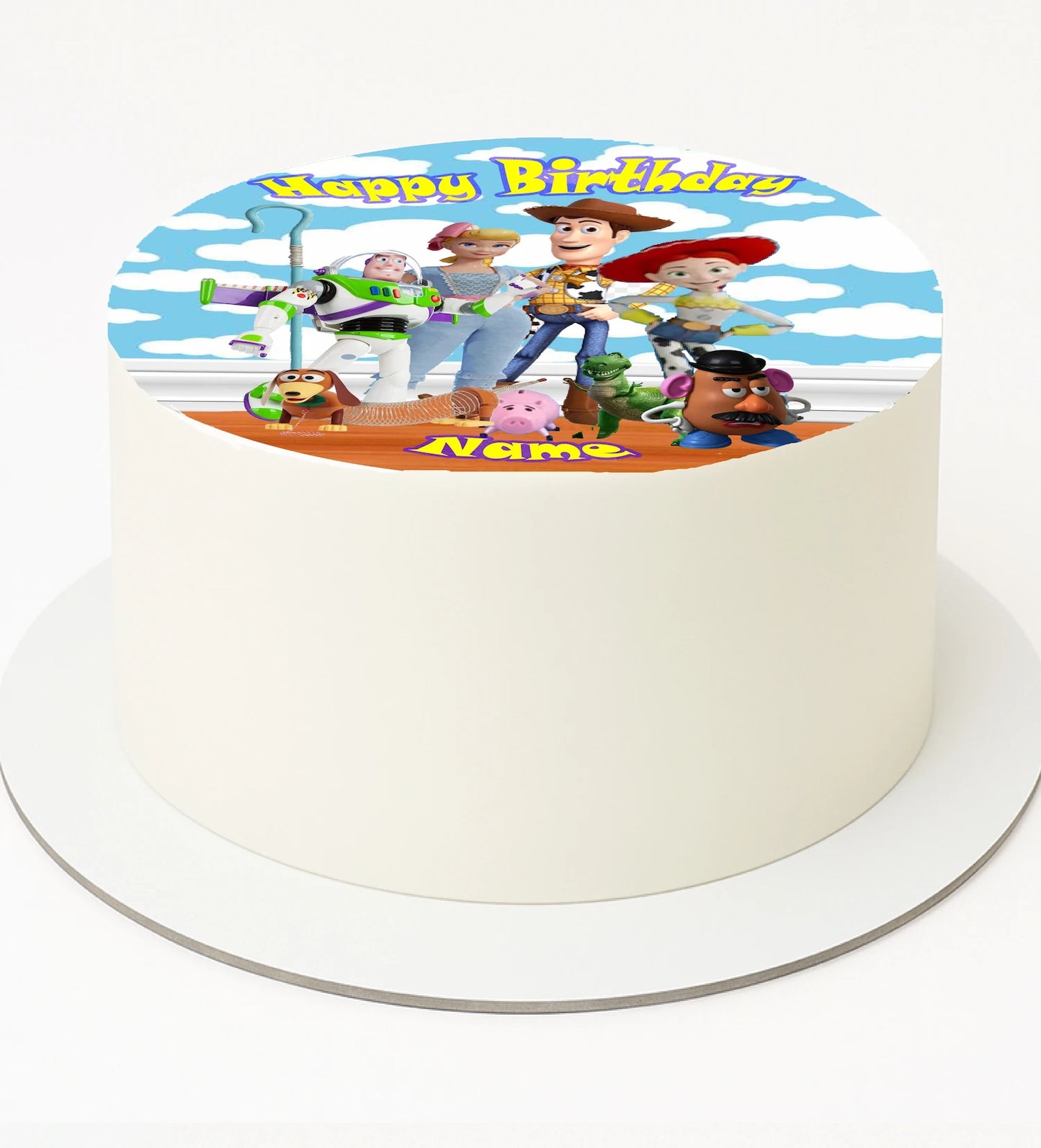 Toy Story-themed birthday cake with characters.