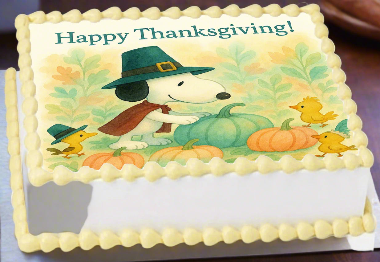 Happy Thanksgiving image of Snoopy and Woodstock in a brightly colored pumpkin patch, fall leaves everywhere.  Showcasing edible image cake topper on a cake on a kitchen counter