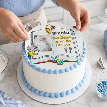 Easy to Apply: placing a precut 8-inch round edible icing topper featuring Baby's First Book design with a boy photo and birth details onto a frosted cake