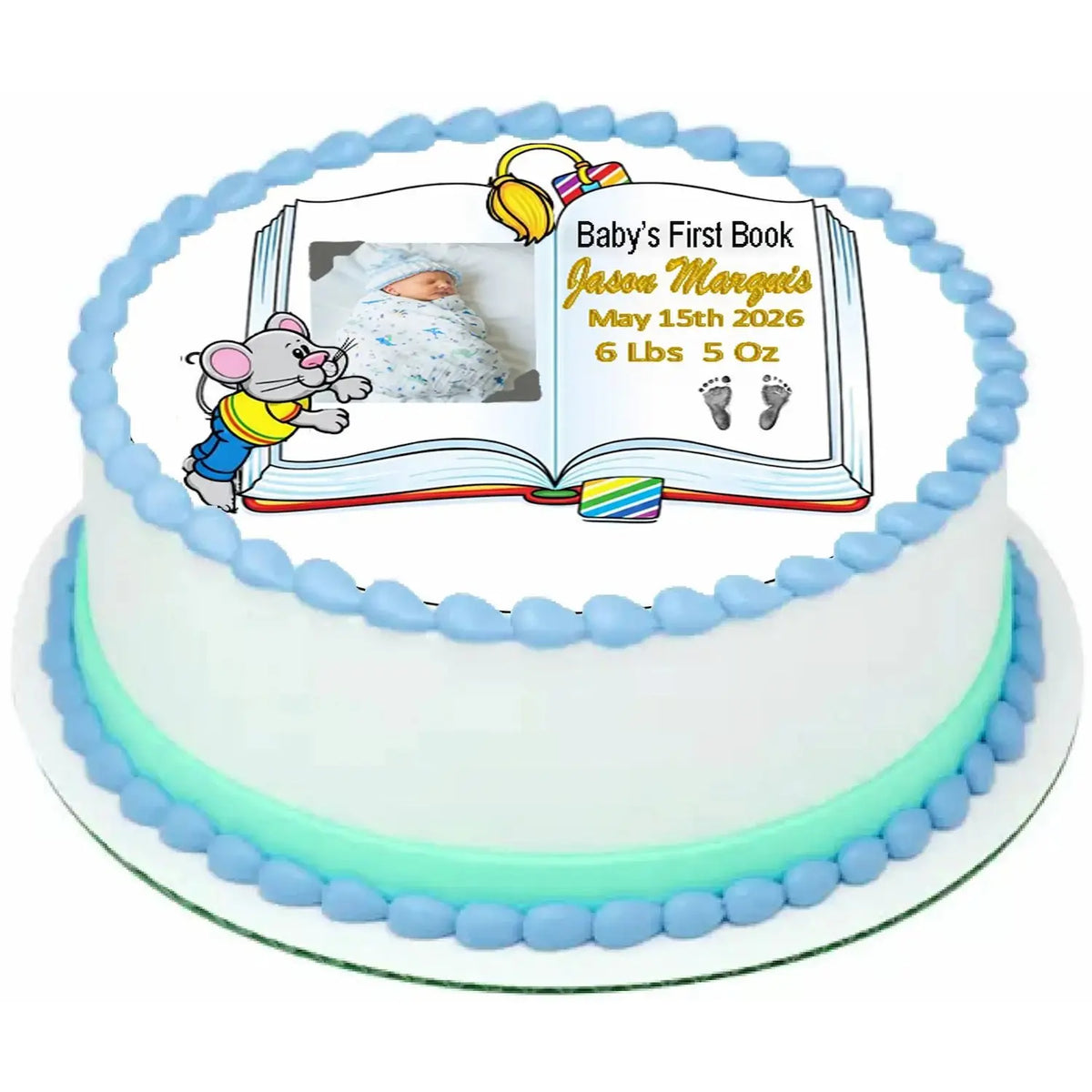 Precut 8-inch round edible icing topper with Baby's First Book design with a boy photo and birth details on a decorated cake