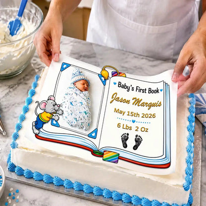 Easy to Apply: placing an 8.5 x 10.5-inch edible icing sheet featuring Baby's First Book design with a boy photo and birth details onto a frosted cake