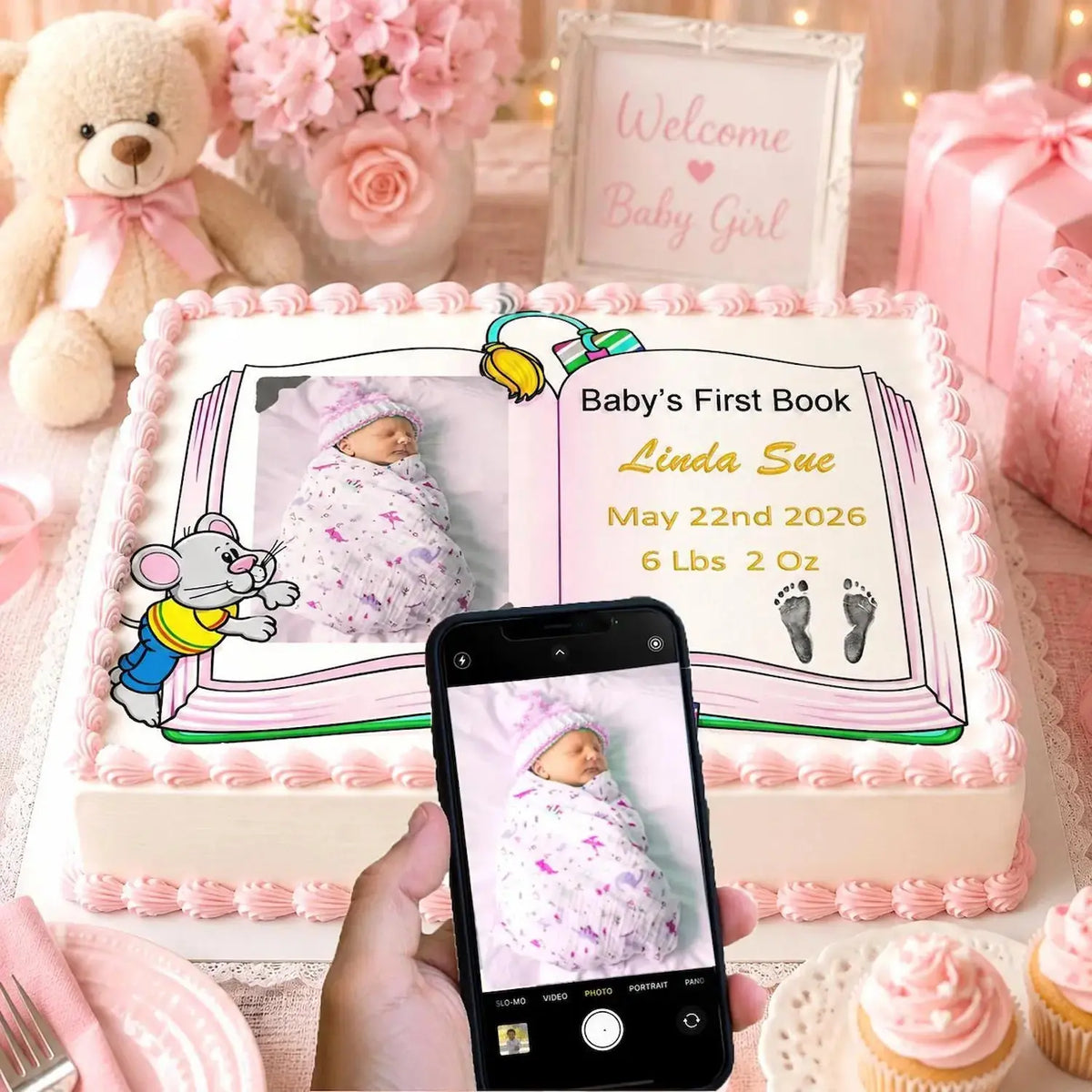 In Use: edible icing cake topper featuring Baby's First Book design with a girl photo and birth details at a baby shower