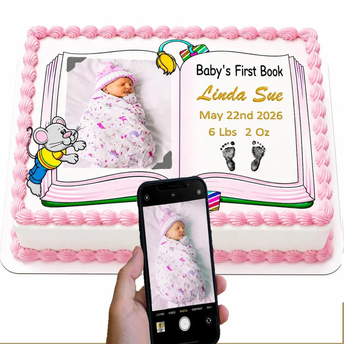 Personalized edible icing cake topper with Baby's First Book design with a girl photo and birth details, shown beside the original photo