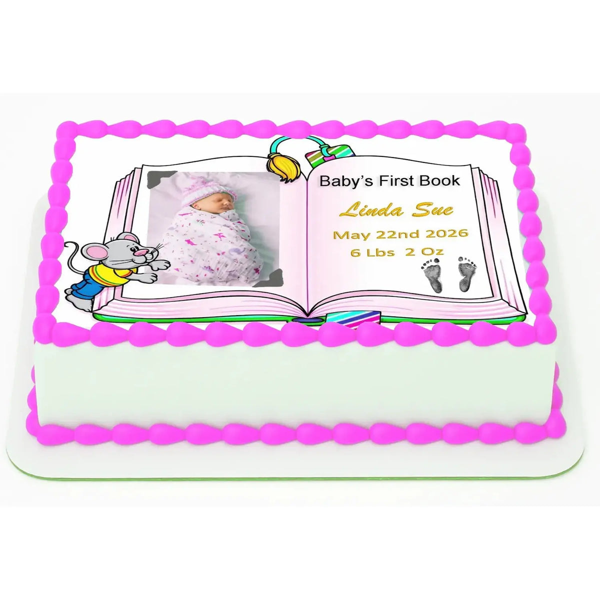 8.5 x 10.5-inch edible icing sheet with Baby's First Book design with a girl photo and birth details on a decorated cake