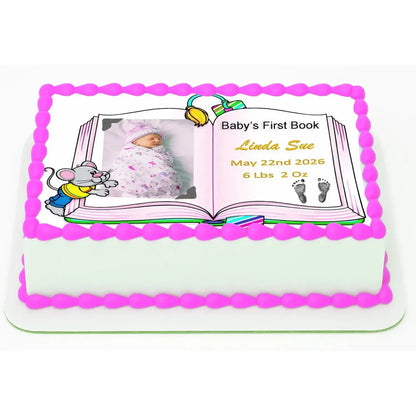 8.5 x 10.5-inch edible icing sheet with Baby's First Book design with a girl photo and birth details on a decorated cake