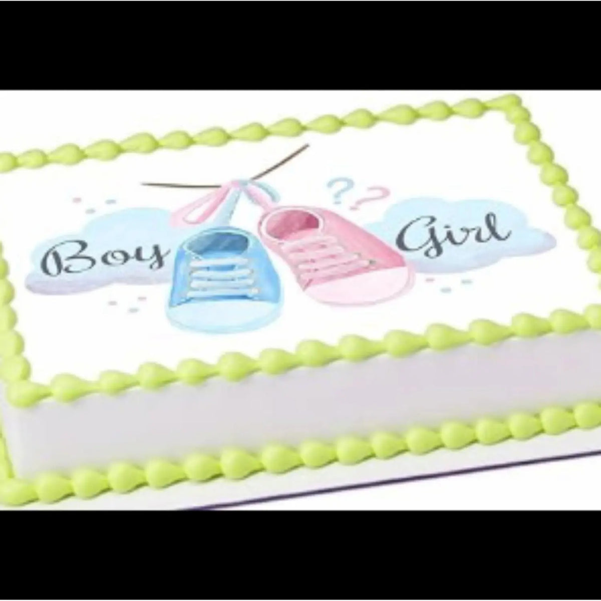 8.5 x 10.5-inch edible icing sheet featuring pink and blue baby shoes on a cake with green frosting trim