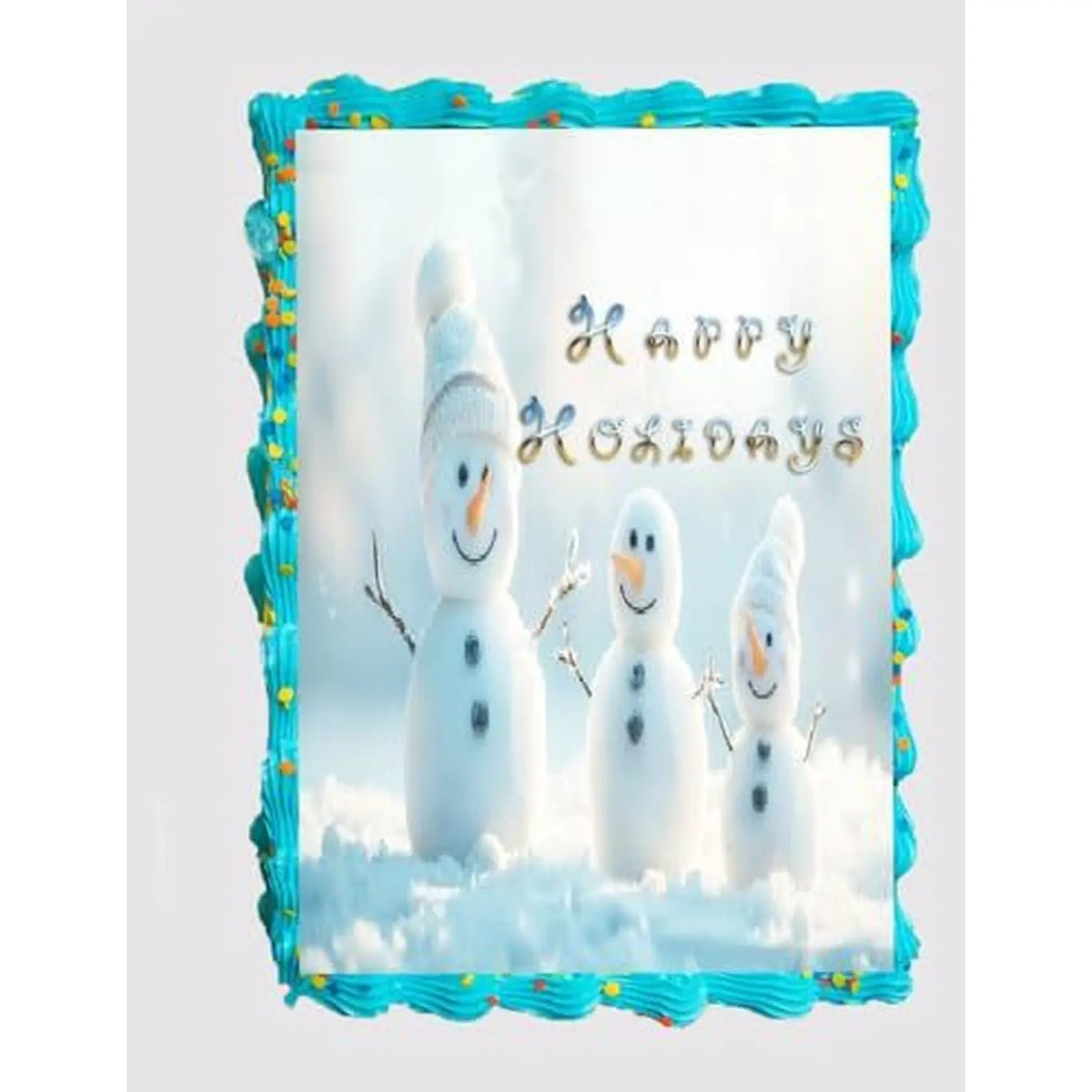 Christmas Snowmen edible icing sheet cake topper shown on a frosted sheet cake.