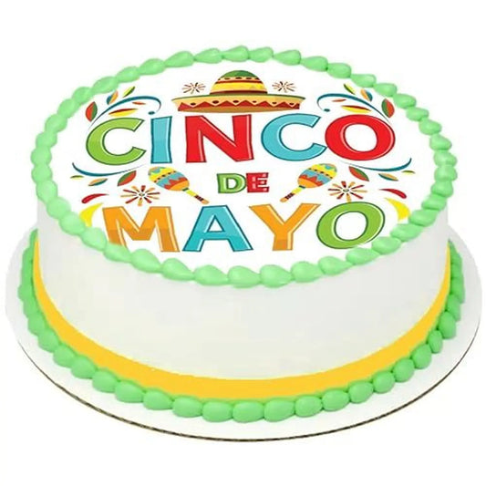 Cinco de Mayo edible icing cake topper with Cinco de Mayo lettering, on a cake with green frosting.