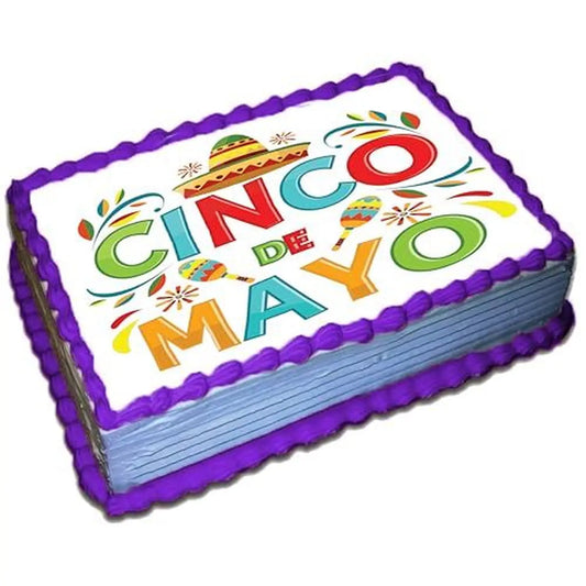 Cinco de Mayo edible icing cake topper with Cinco de Mayo lettering, on a purple frosted sheet cake.